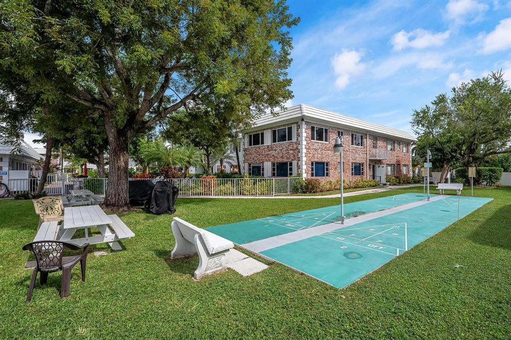 350 South Cypress Road, Unit 521 Pompano Beach, FL 33060 - Photo 16 of 18 a view of a house with a backyard