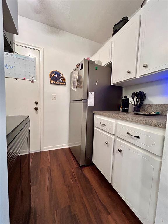 350 South Cypress Road, Unit 521 Pompano Beach, FL 33060 - Photo 6 of 18 a kitchen with stainless steel appliances a refrigerator and cabinets