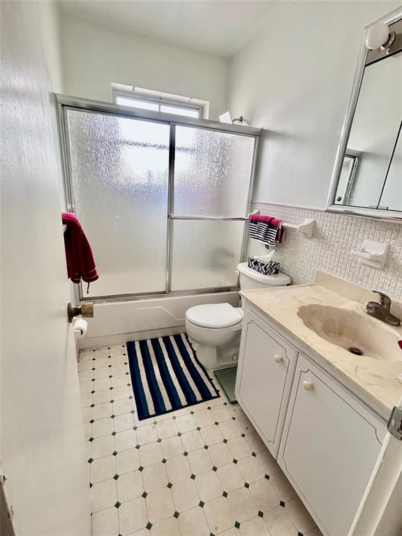 350 South Cypress Road, Unit 521 Pompano Beach, FL 33060 - Photo 9 of 18 a bathroom with a sink toilet and shower
