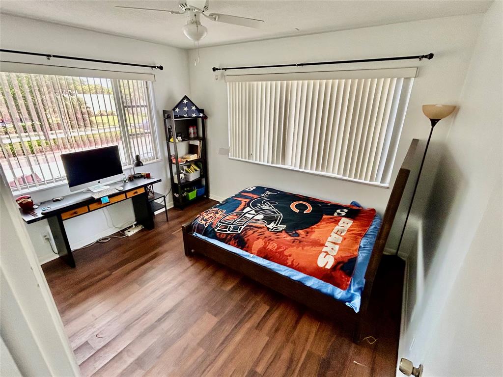 350 South Cypress Road, Unit 521 Pompano Beach, FL 33060 - Photo 10 of 18 a living room with furniture and a flat screen tv