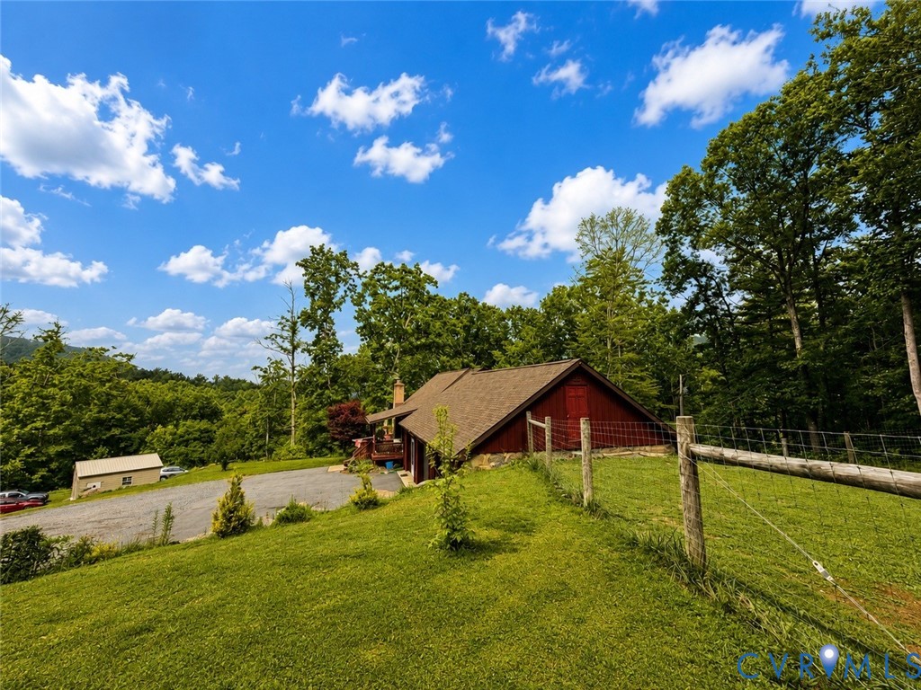 65 Cubbley Road Hot Springs, VA 24445 - Photo 5 of 50 Red exterior siding with a brown shingle roof