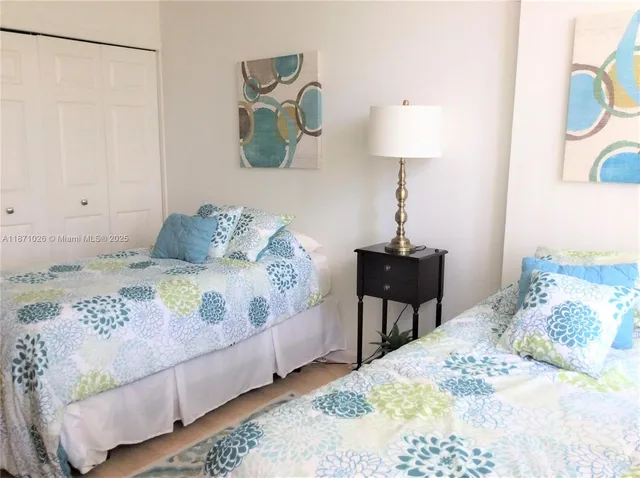 a bedroom with a bed and a table