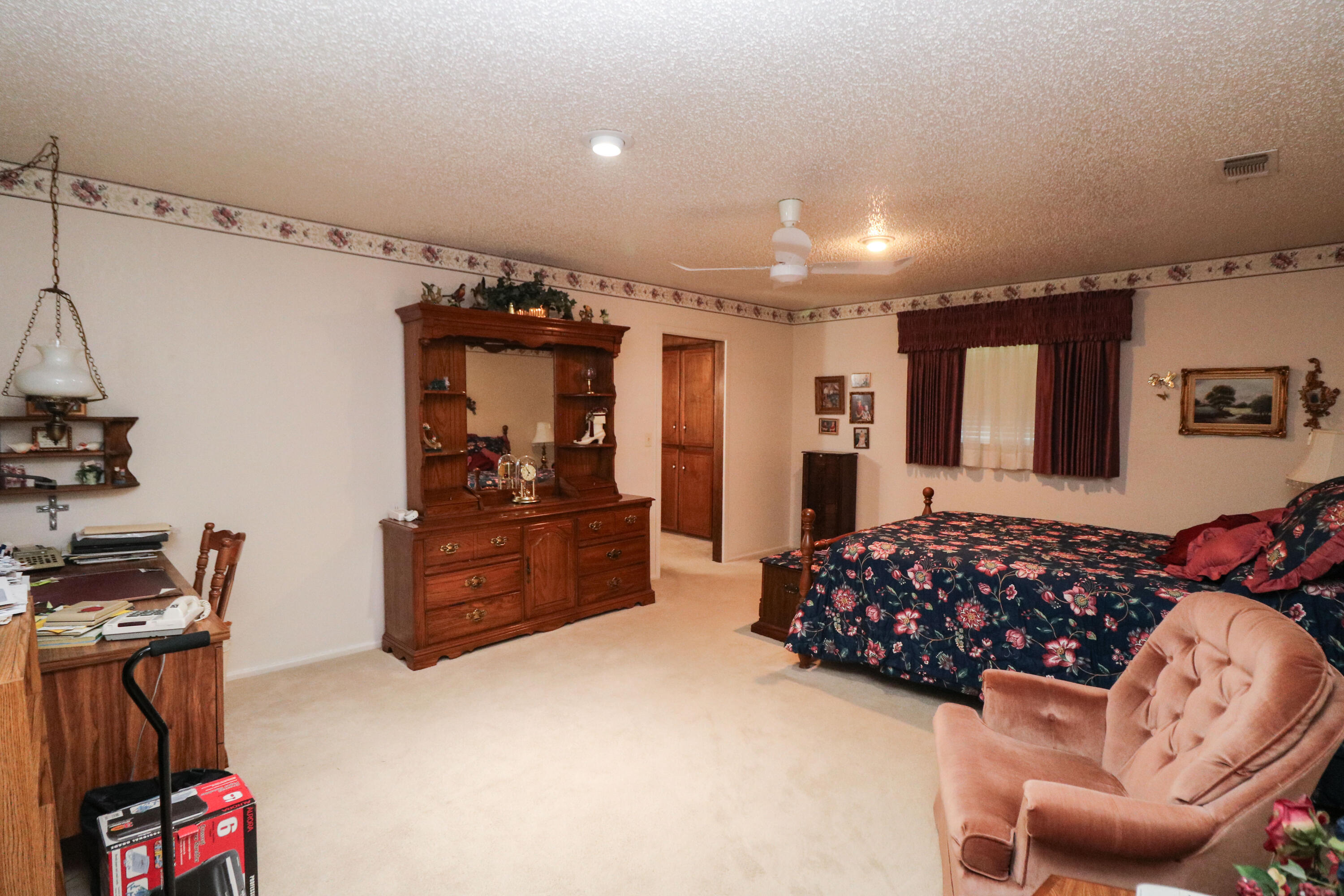 232 East 26th Street Littlefield, TX 79339 - Photo 12 of 26 a bed room with furniture and a window