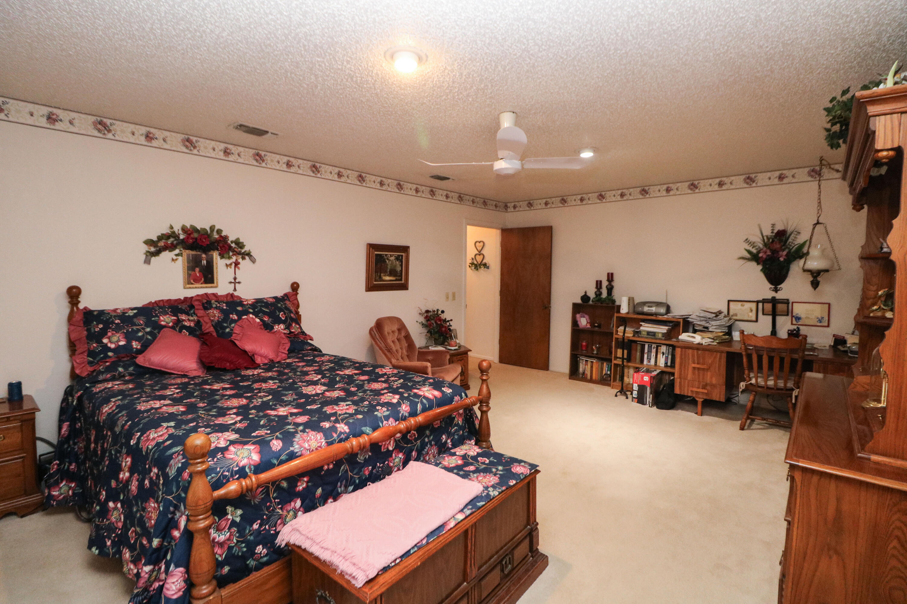 232 East 26th Street Littlefield, TX 79339 - Photo 13 of 26 a bed room with a bed furniture and a flat screen tv