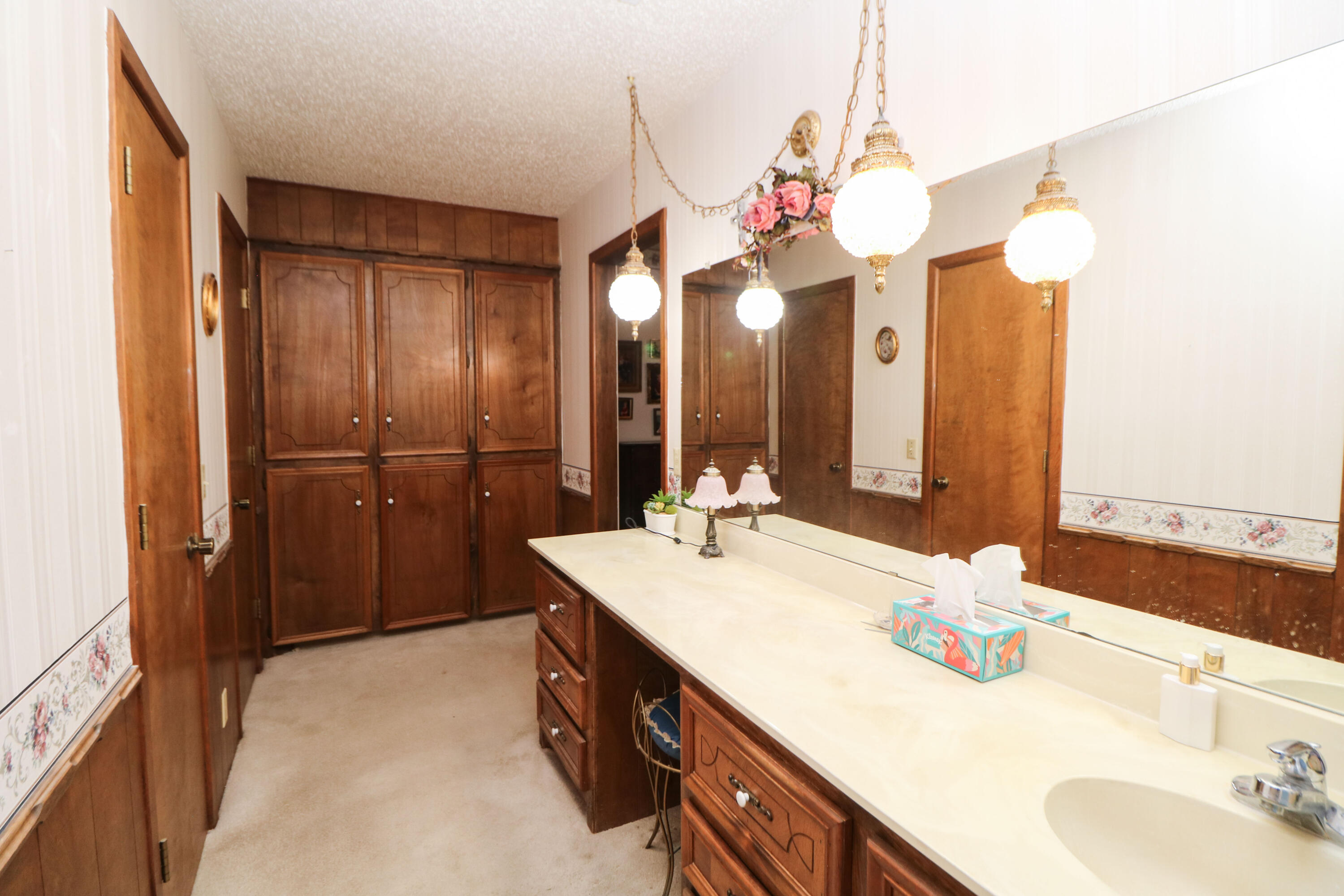 232 East 26th Street Littlefield, TX 79339 - Photo 15 of 26 a bathroom with a sink vanity and a mirror