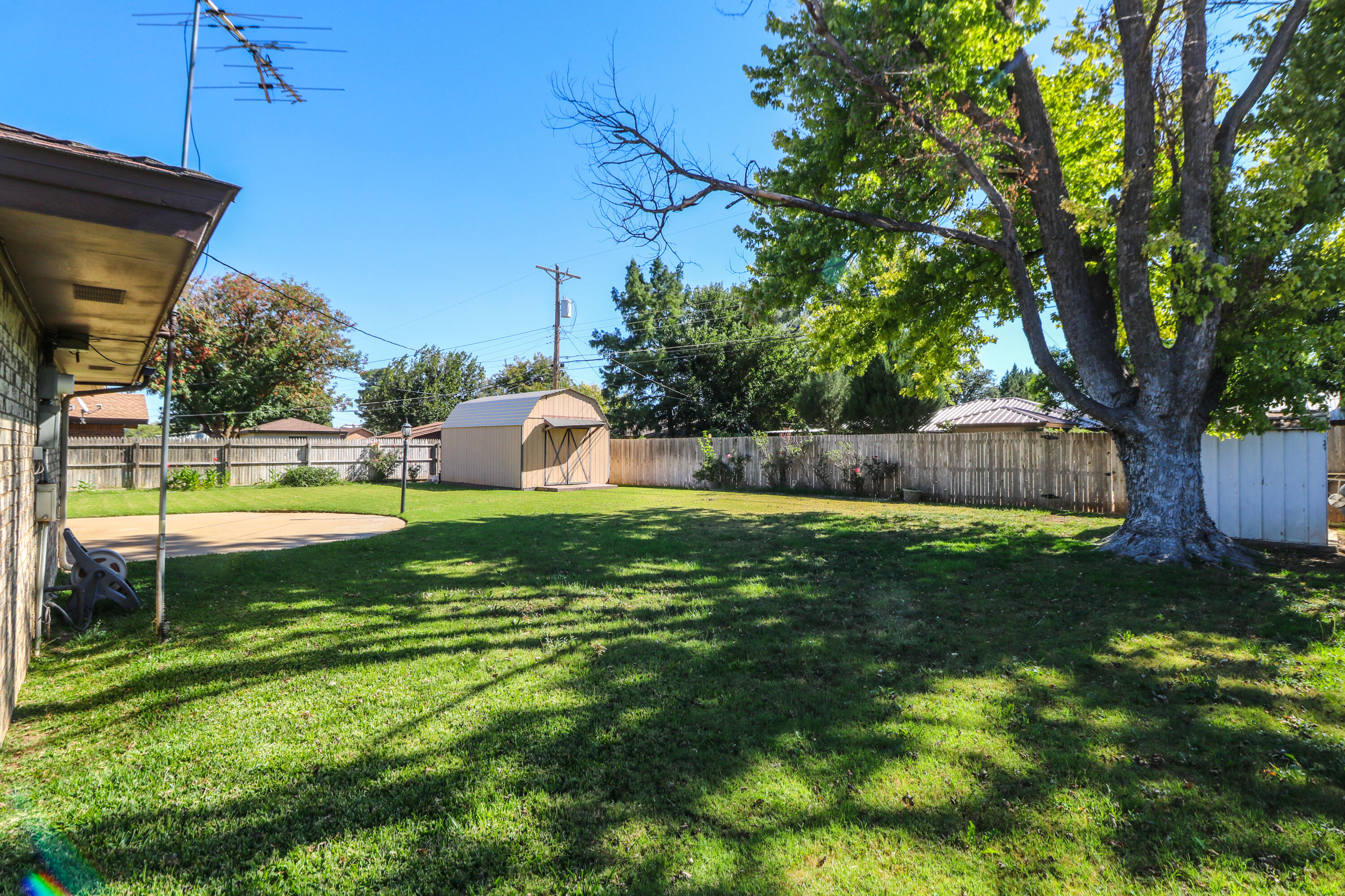232 East 26th Street Littlefield, TX 79339 - Photo 22 of 26 a view of a house with a backyard and a patio