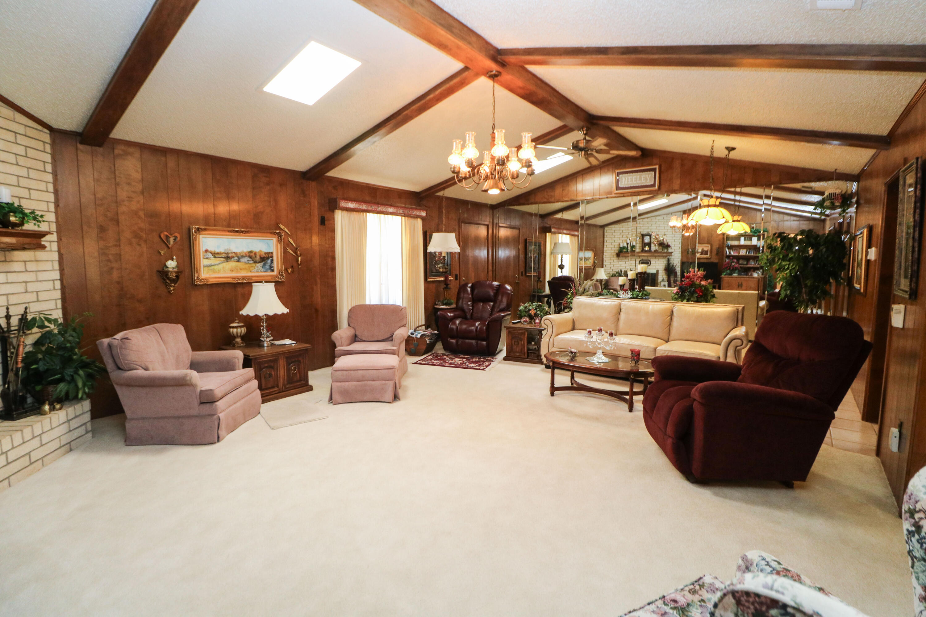 232 East 26th Street Littlefield, TX 79339 - Photo 4 of 26 a living room with furniture and a chandelier