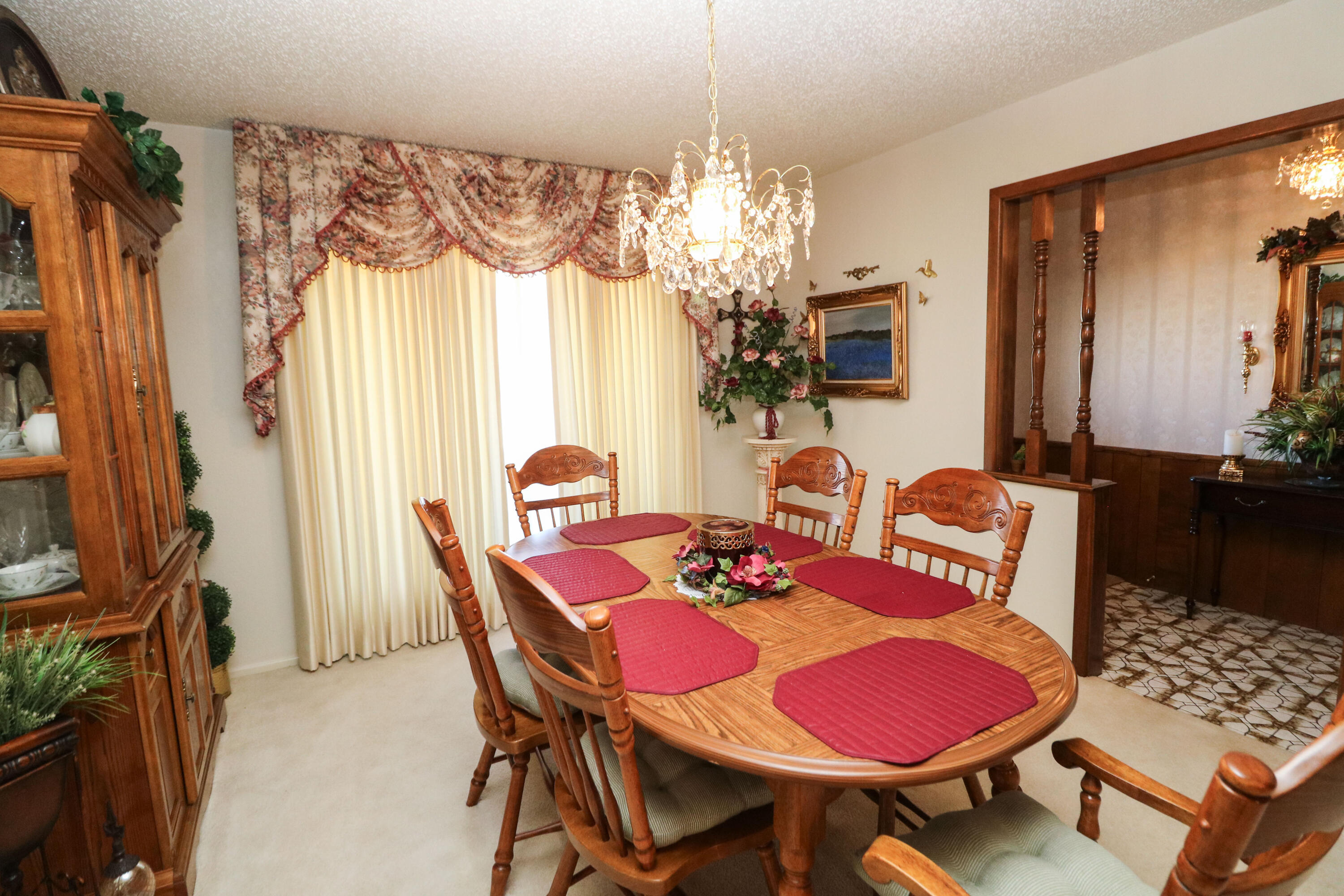 232 East 26th Street Littlefield, TX 79339 - Photo 6 of 26 a view of a dining room with furniture and chandelier