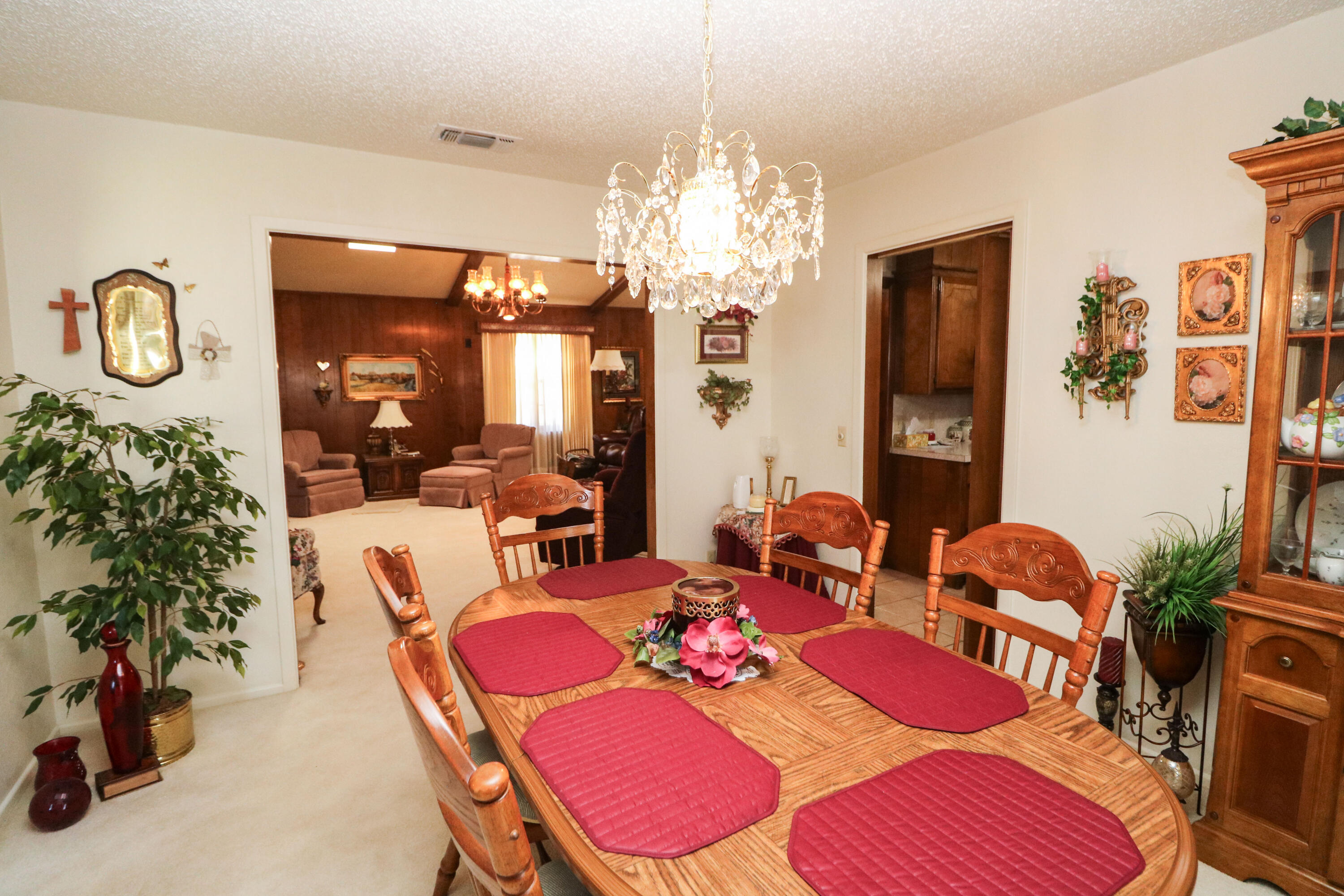 232 East 26th Street Littlefield, TX 79339 - Photo 7 of 26 a view of a dining room with furniture and chandelier