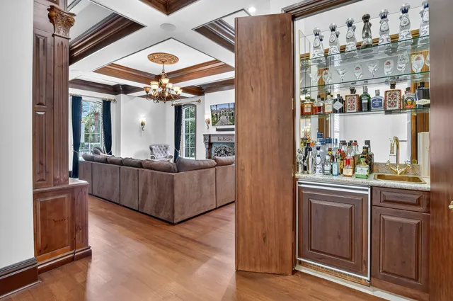 a view of a dining room with furniture and chandelier