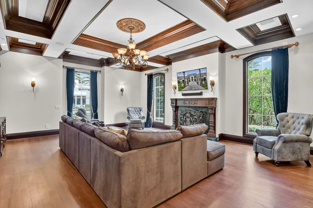 a view of a dining room with furniture and chandelier