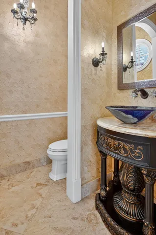 a bedroom with a large bed and a flat tv screen on a dresser