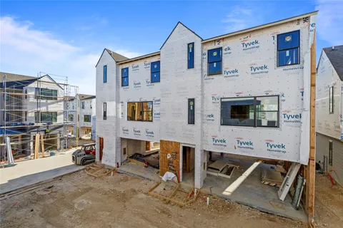a view of residential houses with outdoor space
