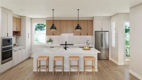 a kitchen with stainless steel appliances granite countertop a dining table chairs refrigerator and microwave