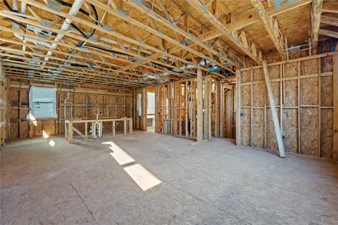 a view of an empty room with wooden walls