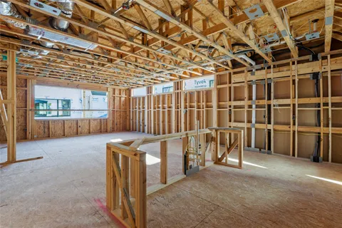 a view of an empty room with wooden walls