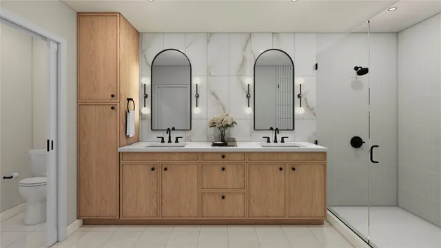 a bathroom with a double vanity sink and mirror with shower