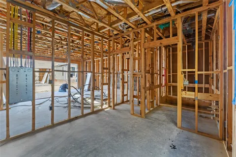 a view of an empty room with wooden walls