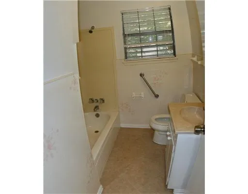 a view of house with garage