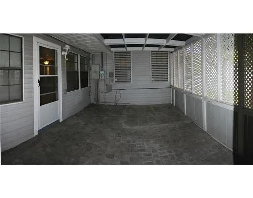 a view of house with backyard porch and outdoor seating