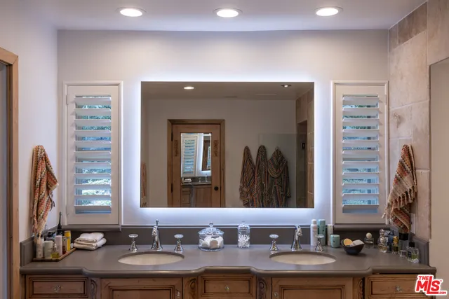 a bedroom with a bed and a tv in it