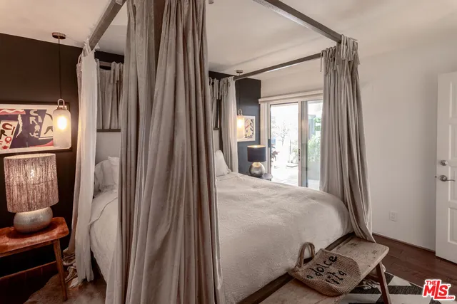 a bathroom with double vanity and a mirror