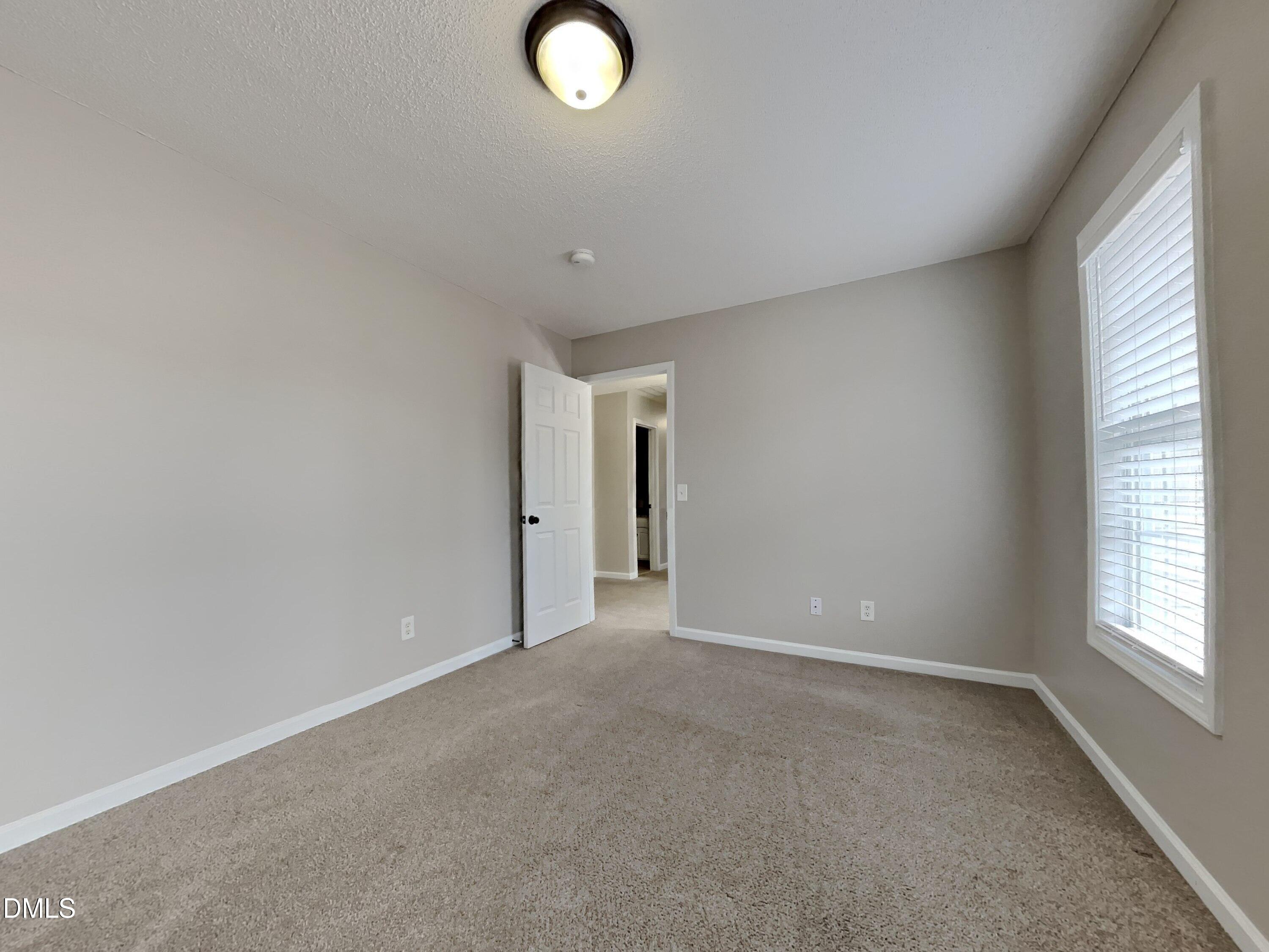 226 Linden Road Cameron, NC 28326 - Photo 13 of 20 a view of an empty room with a window