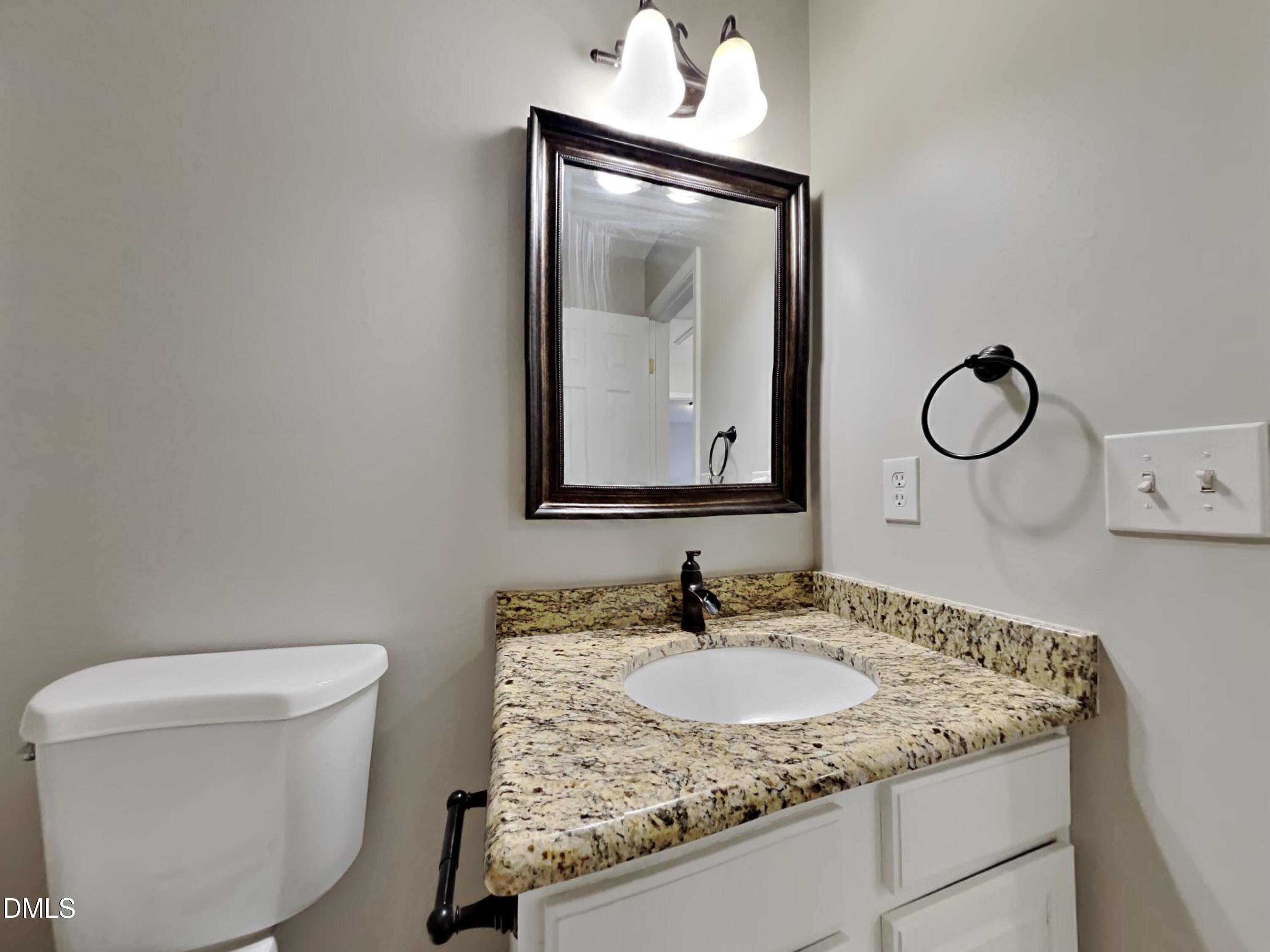 226 Linden Road Cameron, NC 28326 - Photo 14 of 20 a bathroom with a granite countertop sink and a mirror