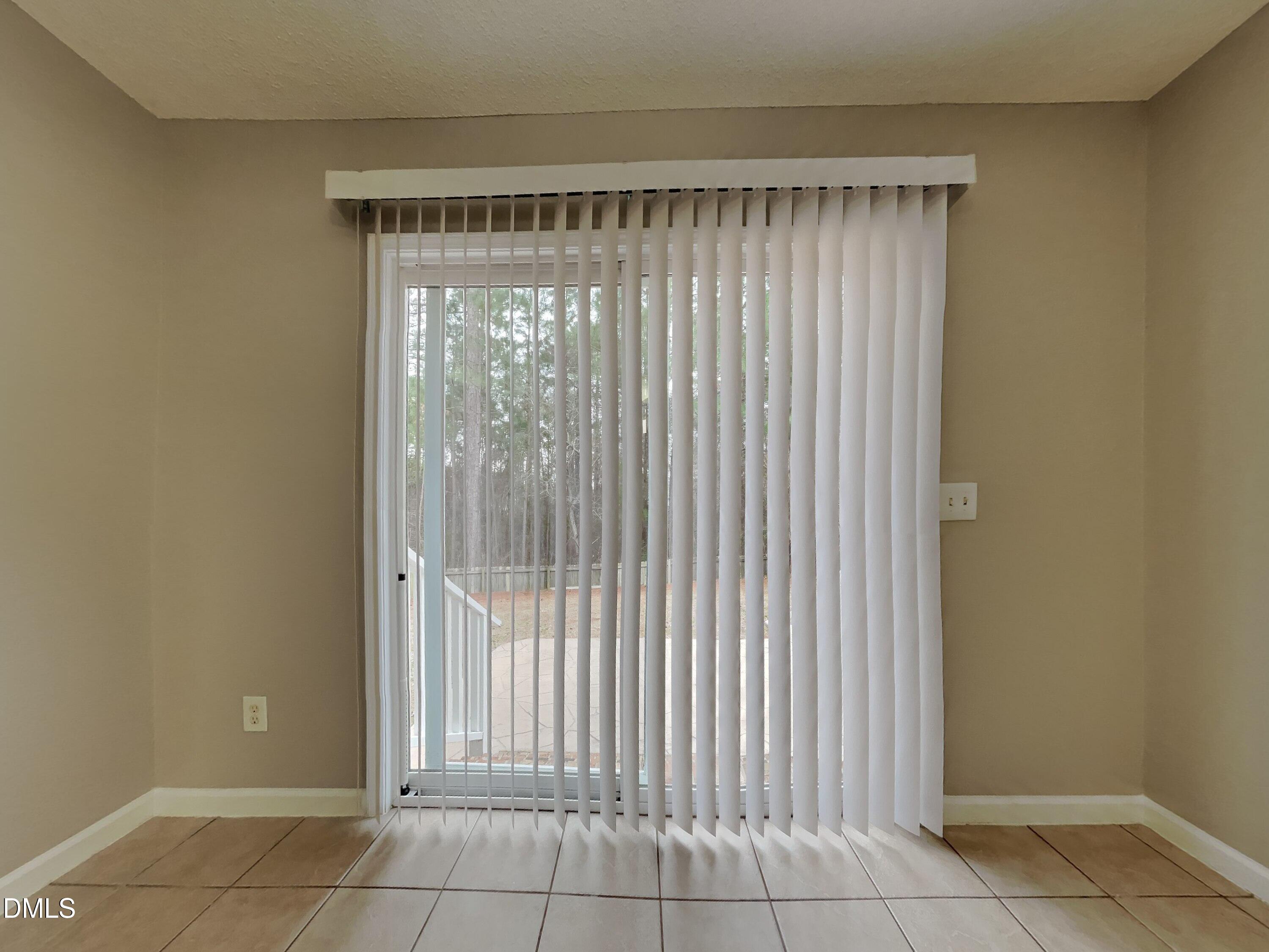 226 Linden Road Cameron, NC 28326 - Photo 5 of 20 a view of a room that has a large window and door
