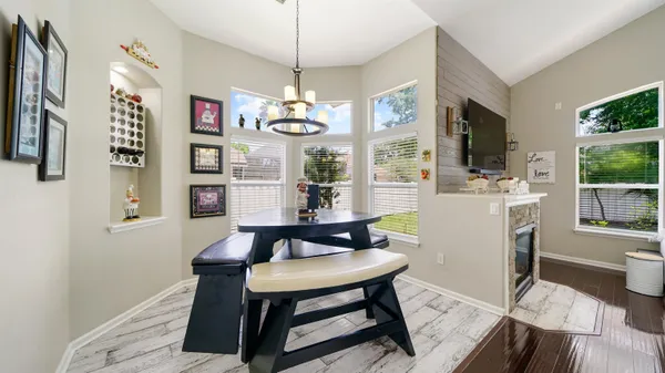 a view of a dining room with furniture window and wooden floor