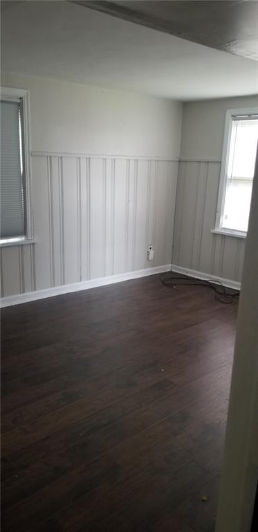 19 Charles Street Dravosburg, PA 15034 - Photo 13 of 18 a view of an empty room with wooden floor and a window