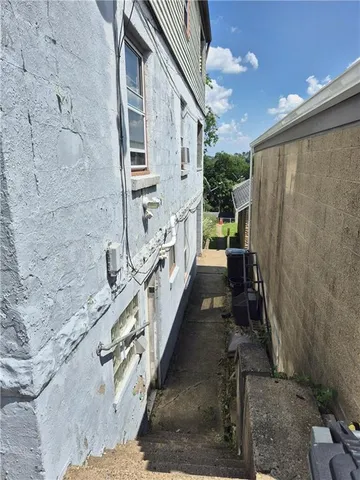a view of a back yard with patio