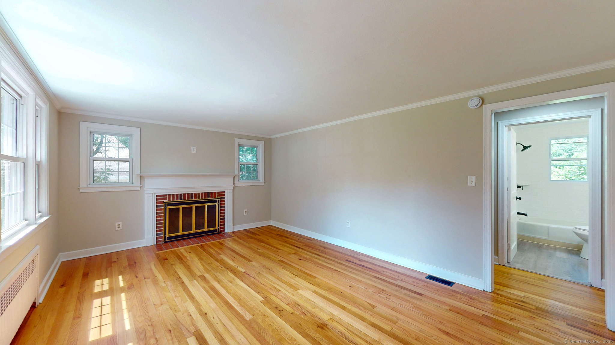 86 Gabb Road Bloomfield, CT 06002 - Photo 11 of 40 wooden floor in an empty room with a fireplace