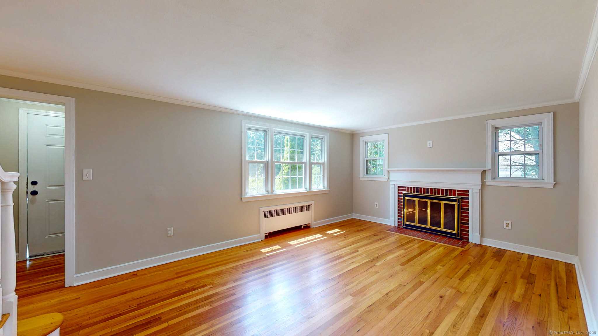 86 Gabb Road Bloomfield, CT 06002 - Photo 12 of 40 wooden floor fireplace and windows in an empty room
