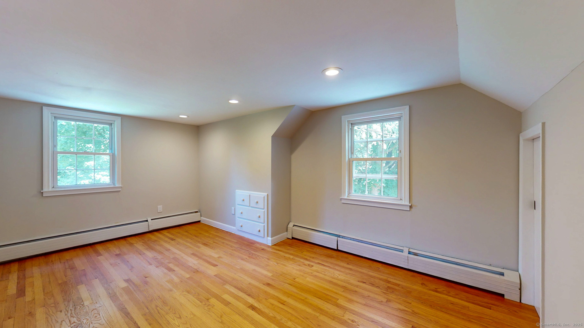 86 Gabb Road Bloomfield, CT 06002 - Photo 19 of 40 an empty room with wooden floor and windows