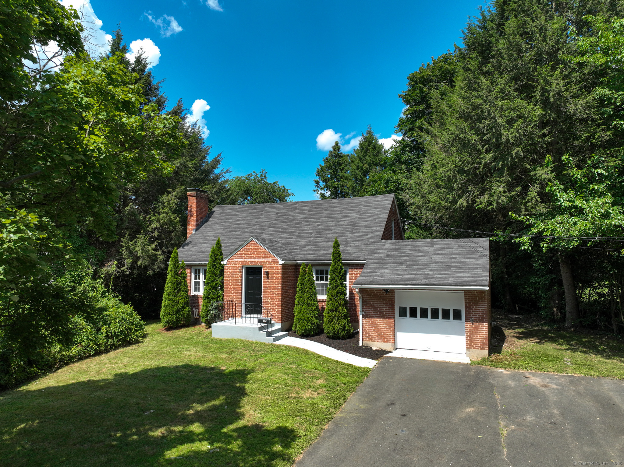 86 Gabb Road Bloomfield, CT 06002 - Photo 2 of 40 a front view of a house with a garden