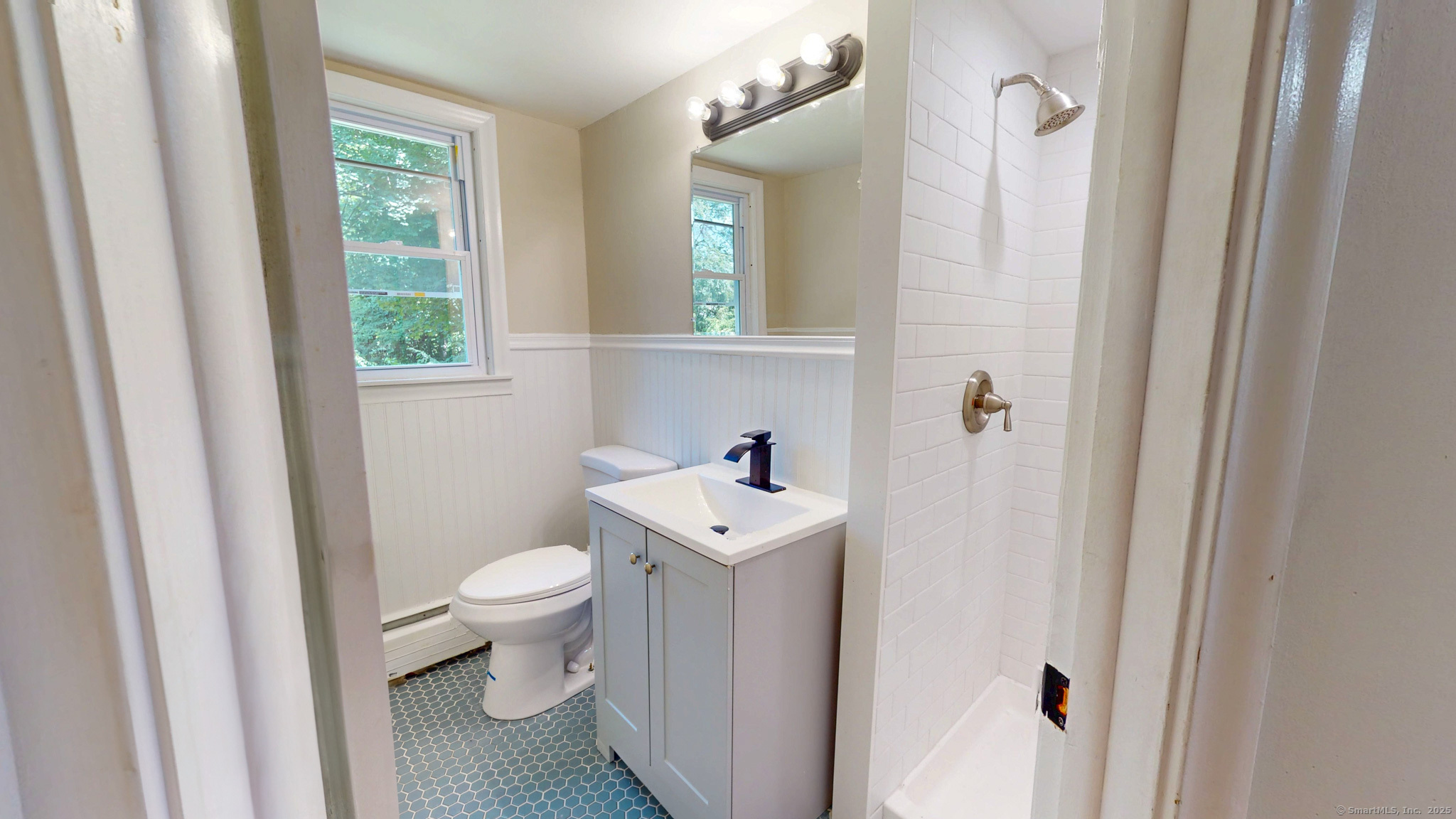 86 Gabb Road Bloomfield, CT 06002 - Photo 25 of 40 a bathroom with a sink a toilet and a mirror