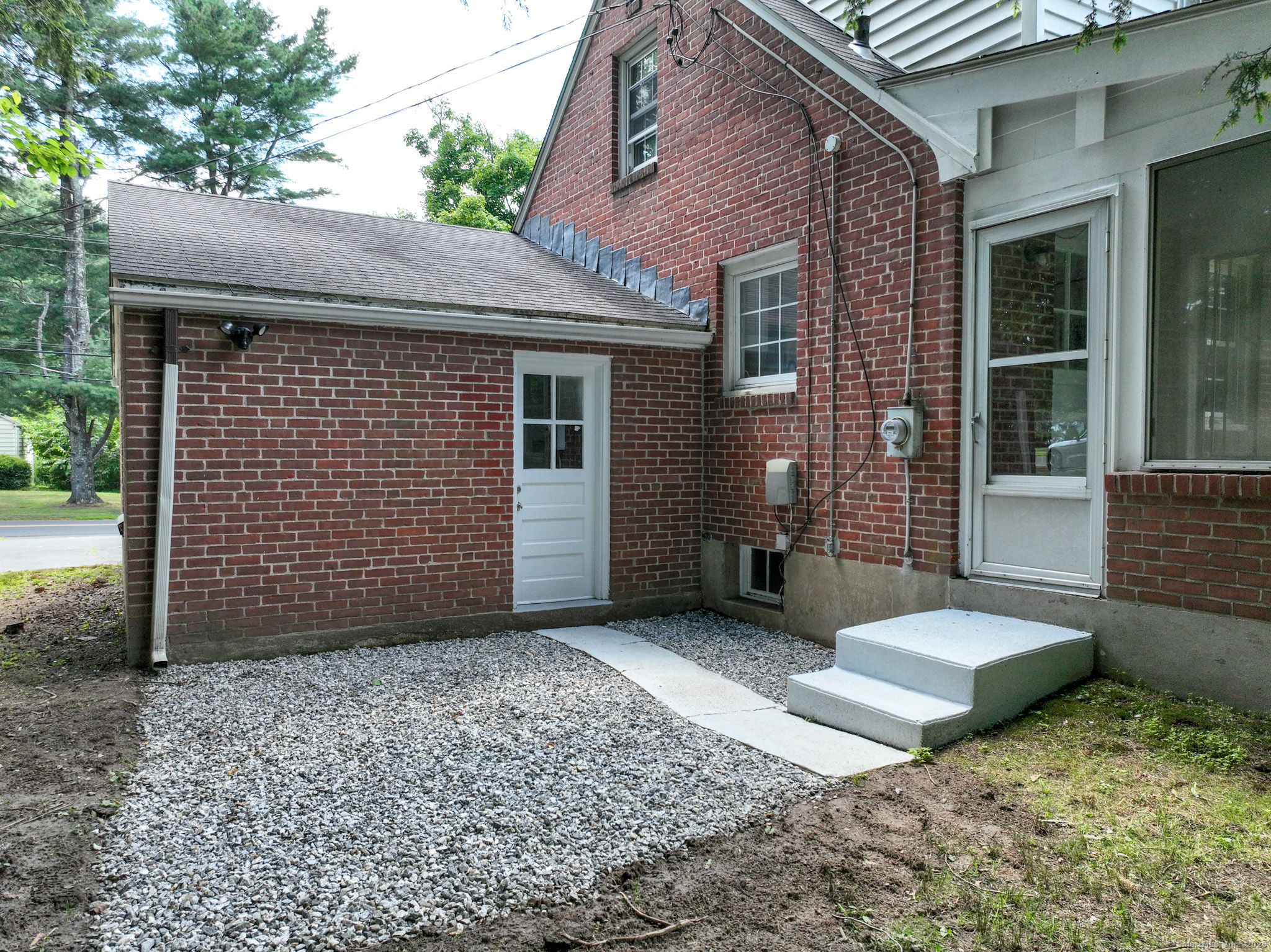86 Gabb Road Bloomfield, CT 06002 - Photo 34 of 40 a view of a house with a large window and wooden fence