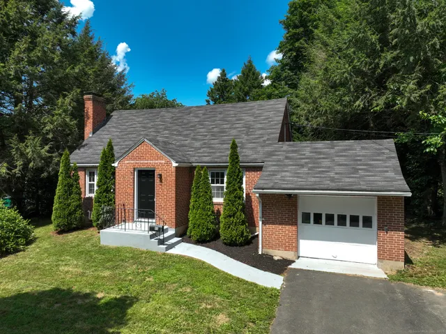 front view of a house with a yard