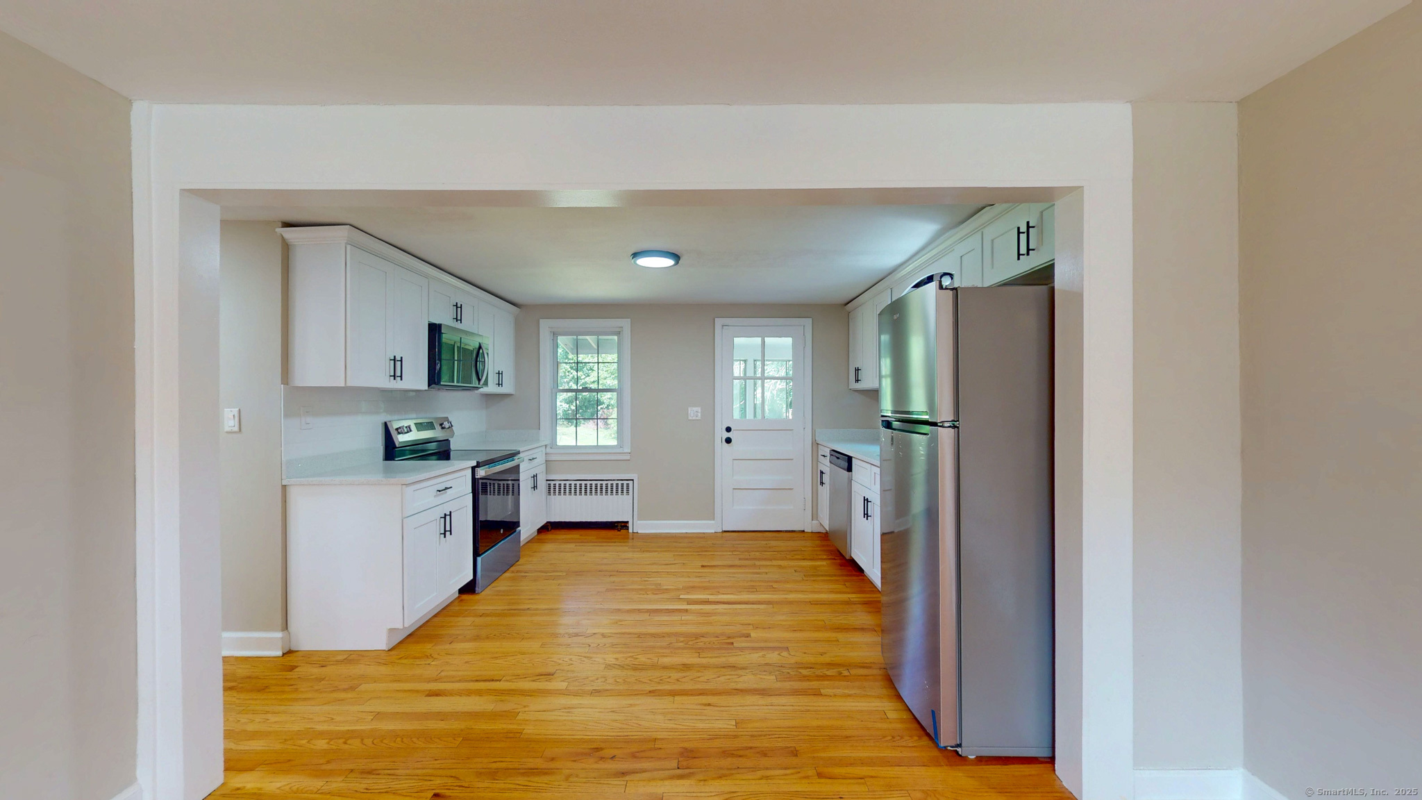 86 Gabb Road Bloomfield, CT 06002 - Photo 7 of 40 a large kitchen with a refrigerator a sink a stove and cabinets