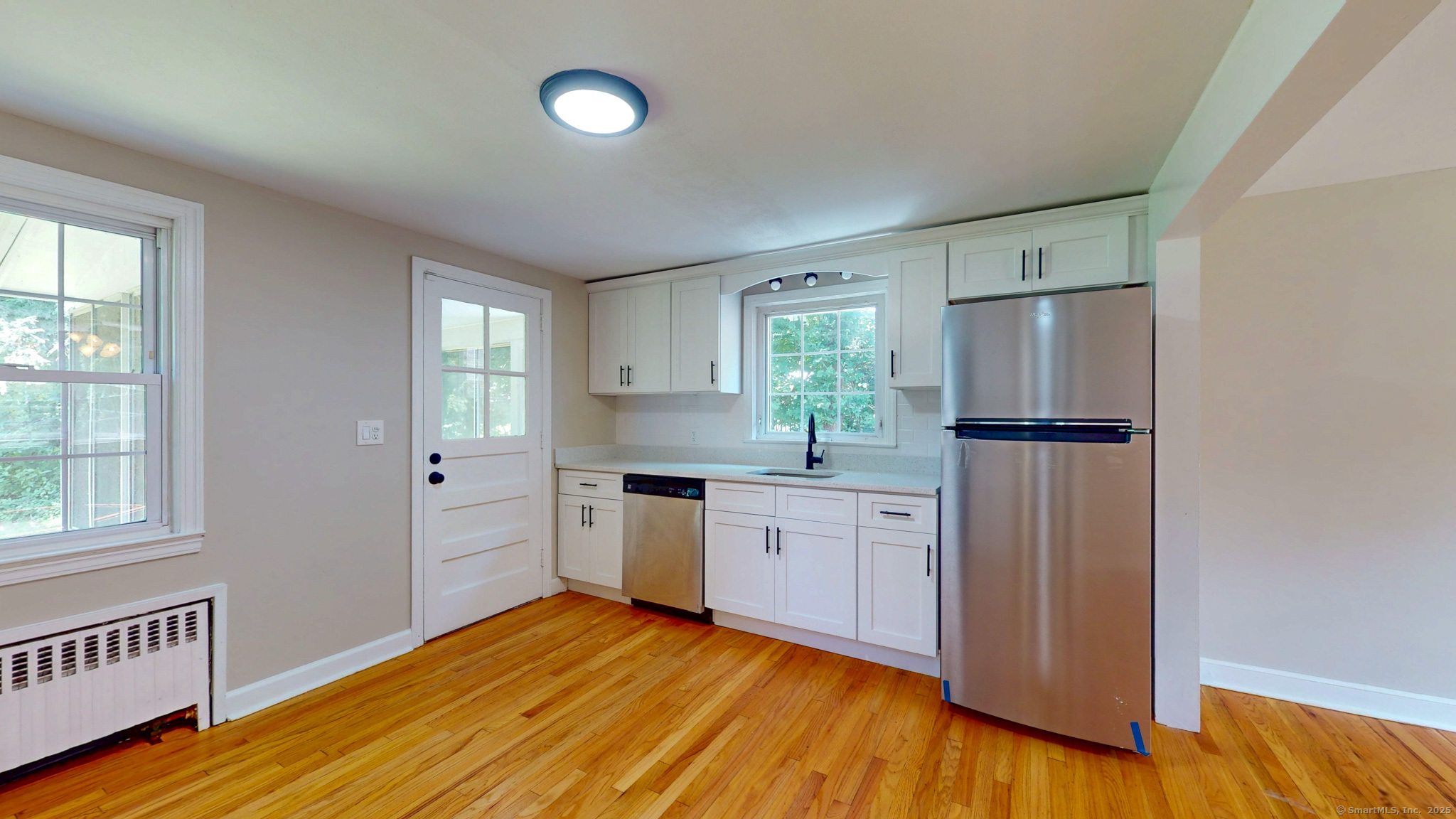 86 Gabb Road Bloomfield, CT 06002 - Photo 8 of 40 a kitchen with stainless steel appliances granite countertop a refrigerator sink and cabinets