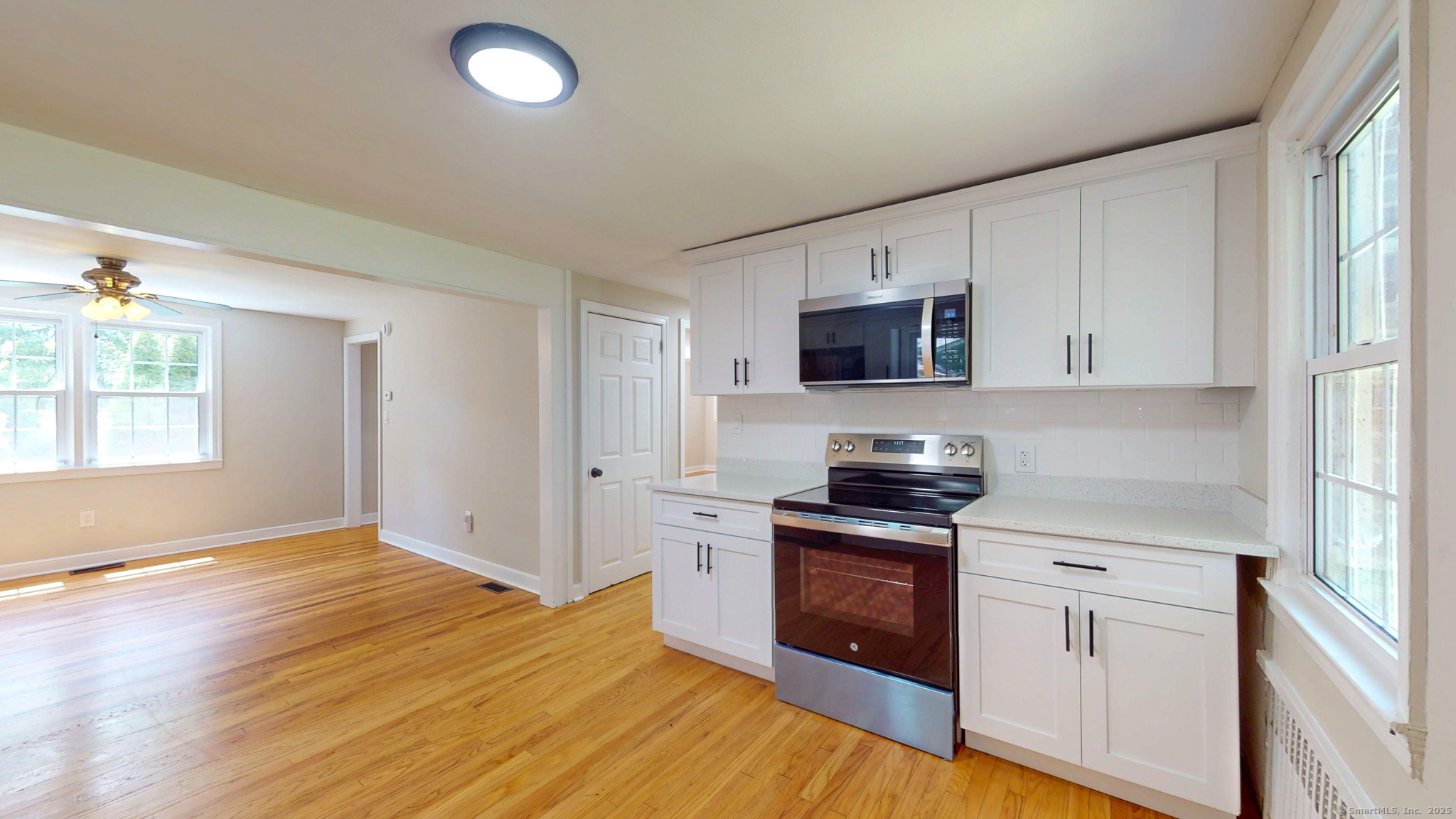 86 Gabb Road Bloomfield, CT 06002 - Photo 9 of 40 a kitchen with granite countertop a stove top oven and cabinets