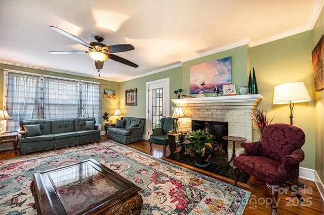 a bedroom with furniture and a flat screen tv