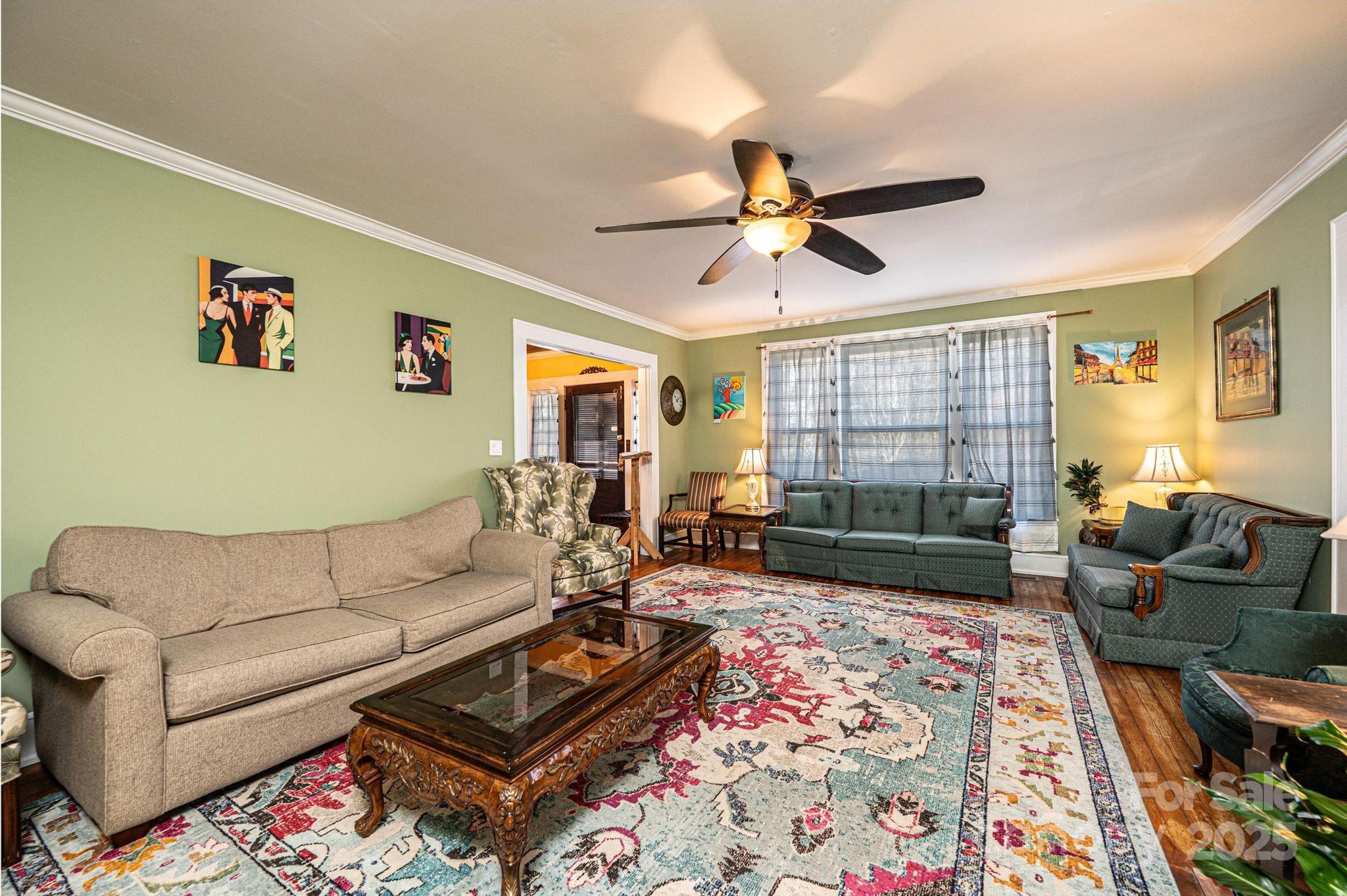 221 3rd Street Northeast Hickory, NC 28601 - Photo 12 of 40 a living room with furniture and a rug