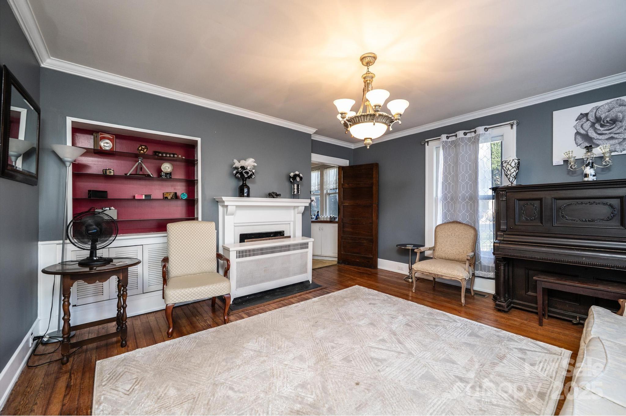 221 3rd Street Northeast Hickory, NC 28601 - Photo 13 of 40 a living room with furniture and a chandelier