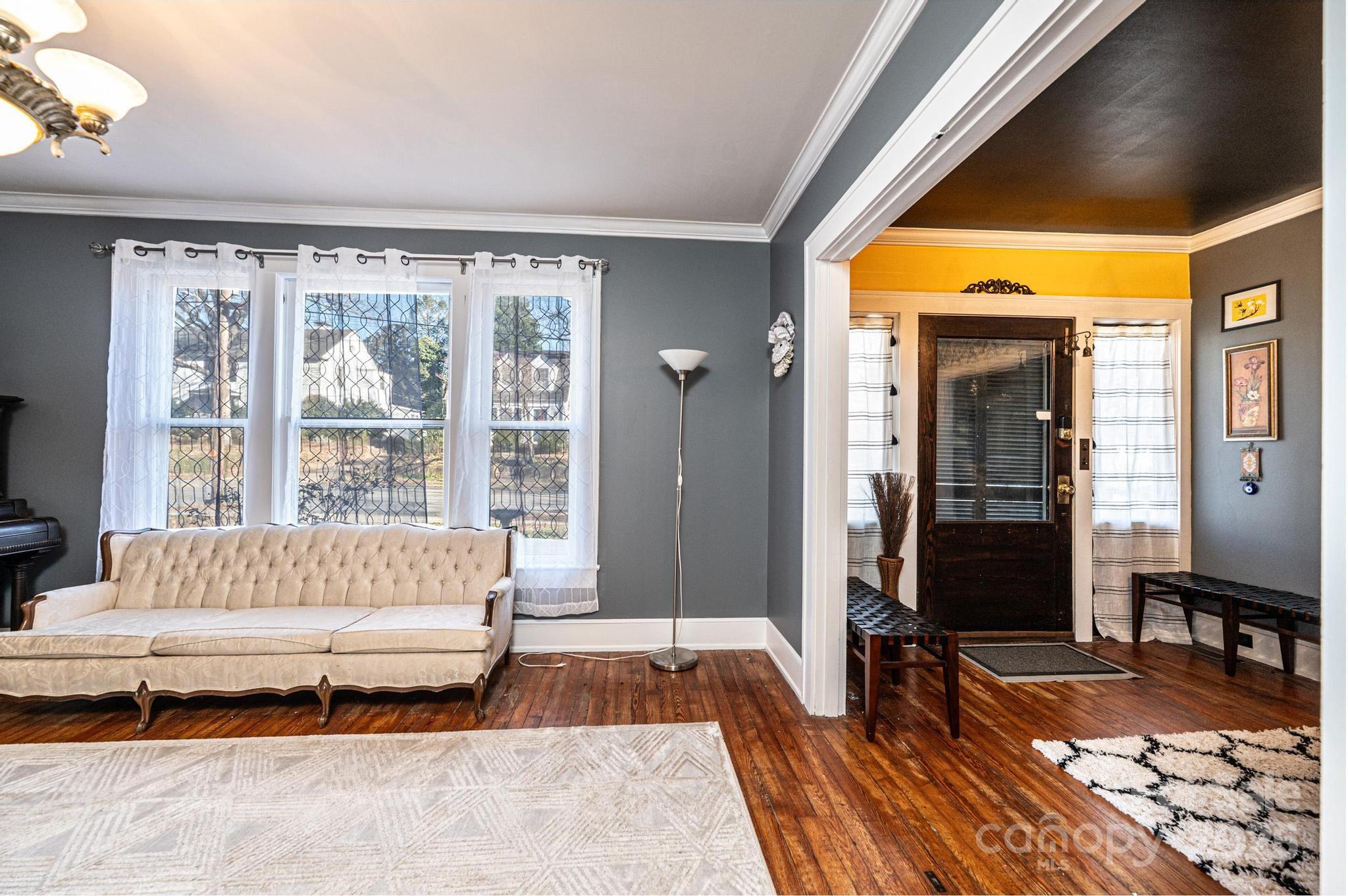 221 3rd Street Northeast Hickory, NC 28601 - Photo 14 of 40 a spacious bedroom with a bed and a large window