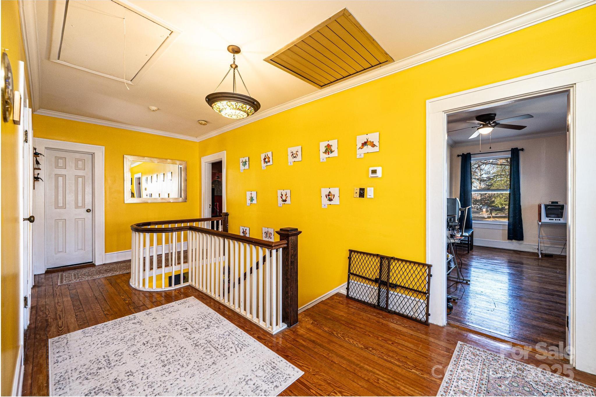 221 3rd Street Northeast Hickory, NC 28601 - Photo 26 of 40 a view of a hallway with wooden floor and a dining table