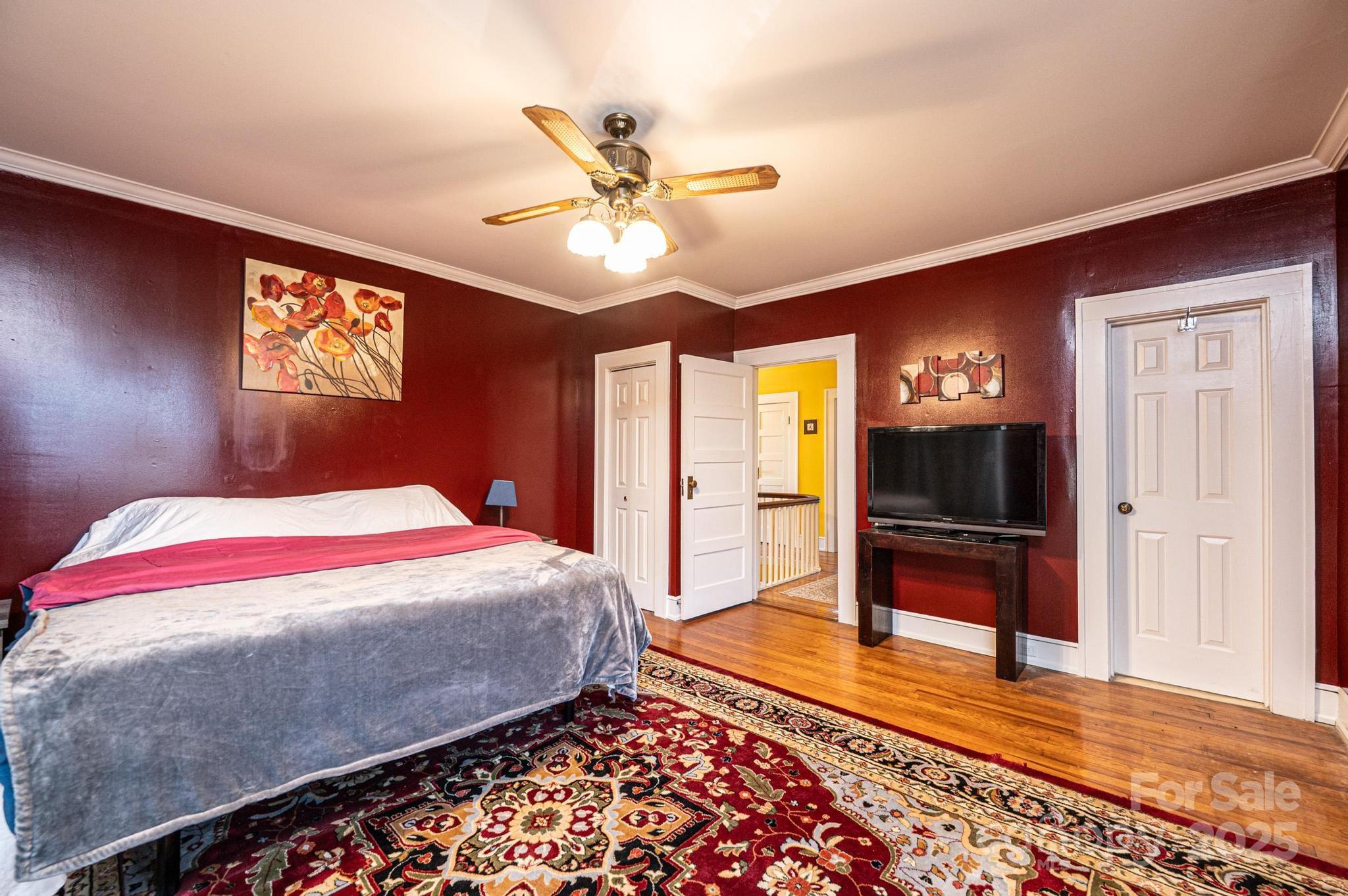221 3rd Street Northeast Hickory, NC 28601 - Photo 31 of 40 a bedroom with a bed and a chandelier