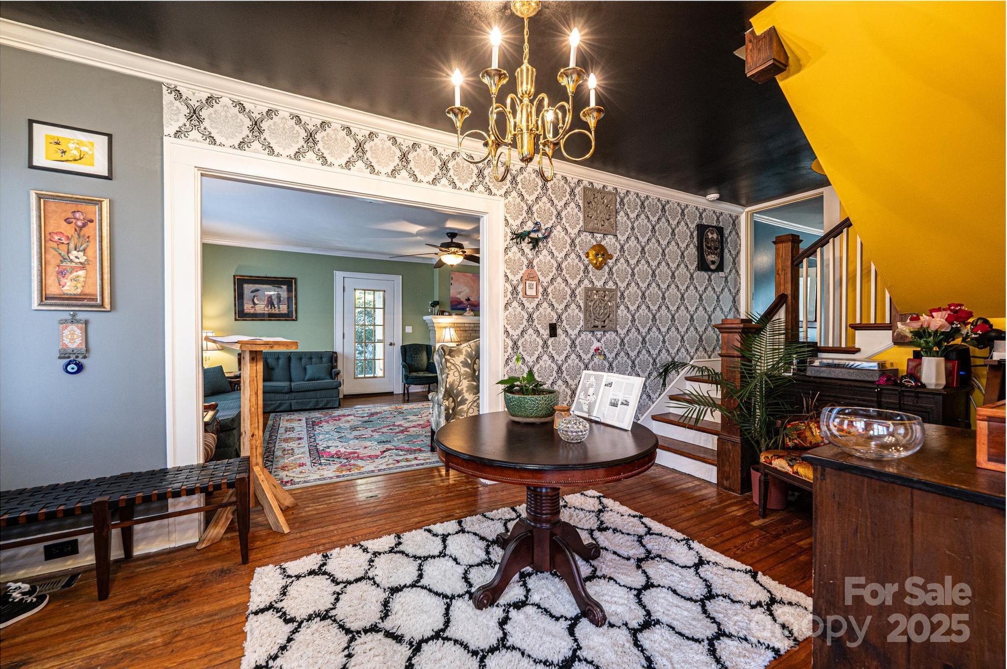 221 3rd Street Northeast Hickory, NC 28601 - Photo 6 of 40 a living room with fireplace furniture and a wooden floor