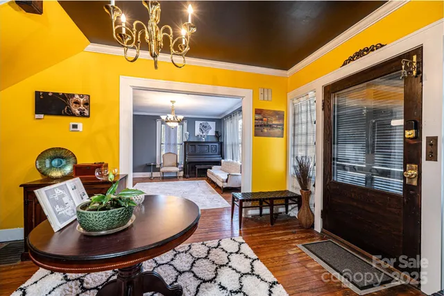 a living room with furniture fireplace and window